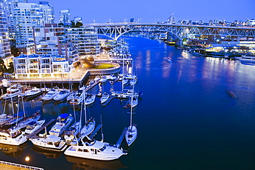 Boats moored on the waterfront in False Creek Harbour, Vancouver, British Columbia, Canada, North America