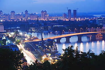 Lights illuminating Podil district and Dnieper River area at night, Kiev, Ukraine, Europe