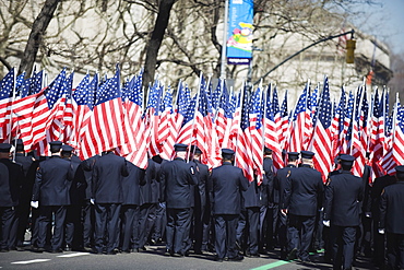 Police carrying American flags, St. Patricks Day celebrations on 5th Avenue, Manhattan, New York City, New York, United States of America, North America