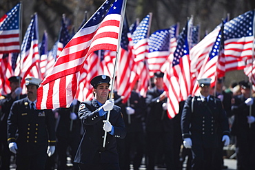 Police carrying American flags, St. Patricks Day celebrations in front of 5th Avenue, Manhattan, New York City, New York, United States of America, North America