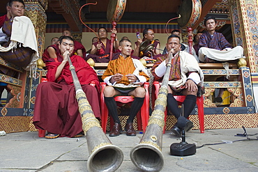 Monks playing horns and drums, Autumn Tsechu (festival) at Trashi Chhoe Dzong, Thimpu, Bhutan, Asia