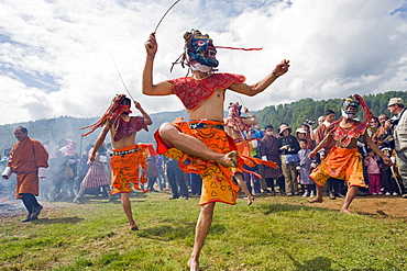 Dancers in costume at Thangbi Mani Tsechu (festival), Jakar, Bumthang, Chokor Valley, Bhutan, Asia