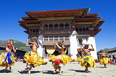 Dancers in costume at Tsechu (festival), Gangtey Gompa (Monastery), Phobjikha Valley, Bhutan, Asia