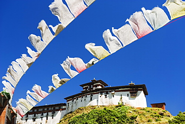 Prayer flags below Wangdue Phodrang Dzong, founded by the Zhabdrung in 1638, Bhutan, Asia