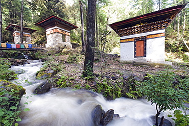 River running through stone cairns on a trail to the Tigers Nest (Taktsang Goemba), Paro Valley, Bhutan, Asia