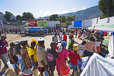 People lining up for water distribution after the January 2010 earthquake, Port au Prince, Haiti, West Indies, Caribbean, Central America