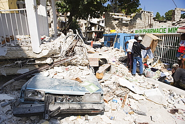 Damaged car and buildings, January 2010 earthquake, Montana Estate, Port au Prince, Haiti, West Indies, Caribbean, Central America