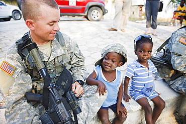 US Army soldier at an orphanage in Port au Prince after the 2010 earthquake, Port au Prince, Haiti, West Indies, Caribbean, Central America