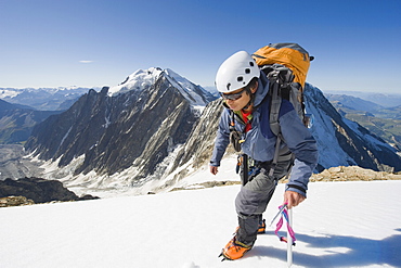 Climber on Aiguille de Bionnassay on the route to Mont Blanc, French Alps, France, Europe