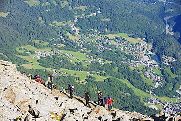 Hikers above Chamonix Valley, Mont Blanc Massif, French Alps, France, Europe