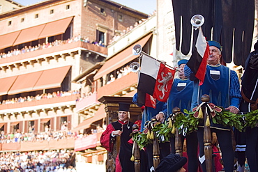 Bugle player in a parade at El Palio horse race festival, Piazza del Campo, Siena, Tuscany, Italy, Europe