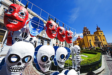 Masks for sale at a street market, Basilica de Nuestra Senora de Guanajuato, Guanajuato, UNESCO World Heritage Site, Guanajuato state, Mexico, North America