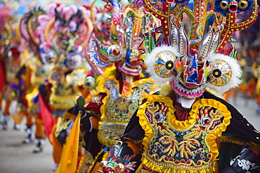 Masked performers in a parade at Oruro Carnival, Oruro, Bolivia, South America