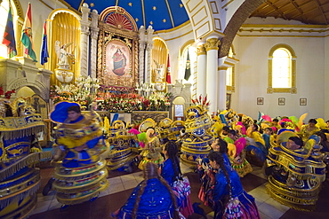 Procession continuing inside church at the Oruro Carnival, Oruro, Bolivia, South America