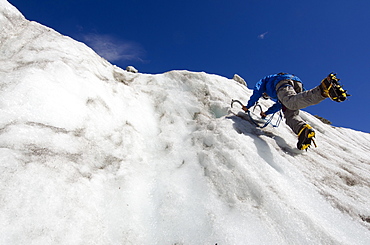 Ice climber at Mer de Glace glacier, Chamonix, Haute-Savoie, French Alps, France, Europe 