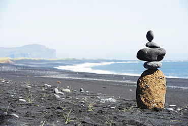 Rock piles and coastal scenery, Vik, Southern Region, Iceland, Polar Regions