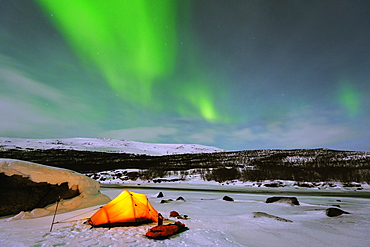 Aurora borealis (Northern lights) and winter camping on Kungsleden (The Kings Trail) hiking trail, Abisko National Park, Sweden, Scandinavia, Europe