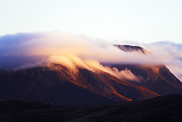 Sunrise on a cloud topped mountain, Andringitra National Park, Ambalavao, central area, Madagascar, Africa