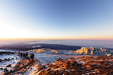 Climbers near the summit and receding glacier of Mount Kilimanjaro, Kilimanjaro National Park, UNESCO World Heritage Site, Tanzania, East Africa, Africa