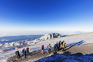 Climbers near the summit and receding glacier of Mount Kilimanjaro, Kilimanjaro National Park, UNESCO World Heritage Site, Tanzania, East Africa, Africa