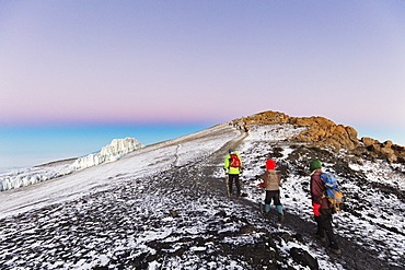 Climbers near the summit and receding glacier of Mount Kilimanjaro, Kilimanjaro National Park, UNESCO World Heritage Site, Tanzania, East Africa, Africa