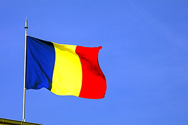 Romanian flag on top of the Arc de Triomph, Bucharest, Romania, Europe