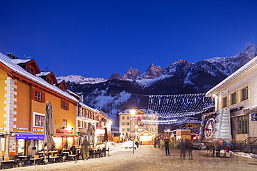 Christmas market decorations against backdrop of Mont Blanc mountain range, Chamonix, Haute Savoie, Rhone Alpes, France, Europe