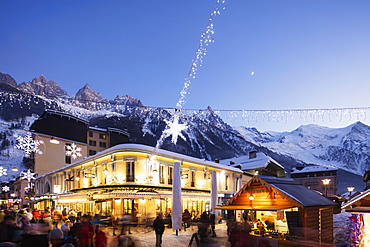 Christmas market decorations against backdrop of Mont Blanc mountain range, Chamonix, Haute Savoie, Rhone Alpes, France, Europe