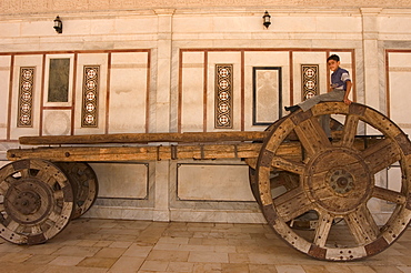 Boy on top of big wheeled cart, Umayyad Mosque, Damascus, Syria, Middle East