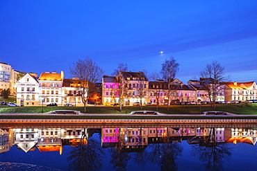 Trinity Suburb reflecting in the Svislach river, Minsk, Belarus, Eastern Europe