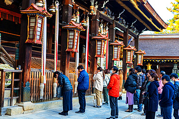 Worshippers at Kitano Tenmangu Shrine, Kyoto, Kansai, Japan, Asia