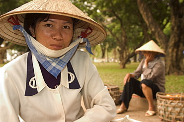 Lady wearing conical hat, Hanoi, Northern Vietnam, Southeast Asia, Asia