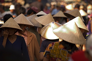 Women wearing conical hats, Binh Tay market, Ho Chi Minh City (Saigon), Vietnam, Southeast Asia, Asia