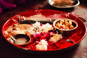 Offering to the Hindu gods durring the tonsuring (mundan) of a small boy, Saijpur Ras, Gujarat, India, Asia