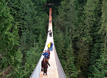 People walking across the Capilano Suspension Bridge, Vancouver, Canada