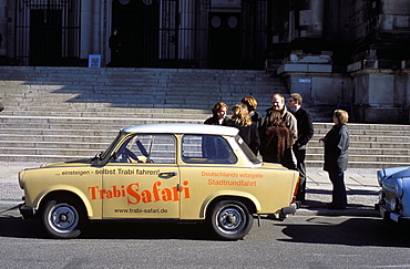 Group of people talking beside a Trabant tour car, Mitte, Berlin, Germany, Europe