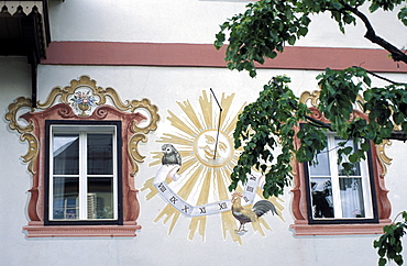 Detail of traditional sun clock (sun dial) on the exterior wall of a building, Zell am See, Salzburgland, Austria, Europe