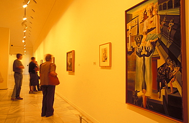 Visitors to the art gallery studying Salvador Dali's El Hombre Invisible (1930) in Museo Nacional Centro de Arte Reina Sofia, Retiro, Madrid, Spain, Europe