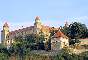 Gothic 15th century castle dominates Bratislava at dusk, Bratislava, Slovakia, Europe