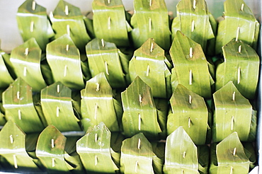 Food wrapped in banana leaf at open air market, Bangkok, Thailand, Southeast Asia, Asia