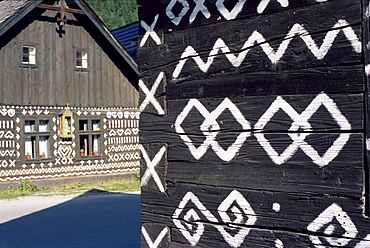 Unique decoration of houses based on patterns used in traditional embroidery in village of Cicmany, UNESCO World Heritage Site, Zilina region, Slovakia, Europe