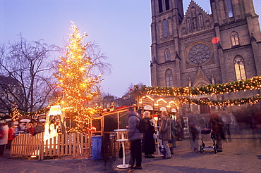 Christmas decoration at market on namesti Miru (square) and neo-Gothic St. Ludmilla church at twilight, Vinohrady, Prague, Czech Republic, Europe