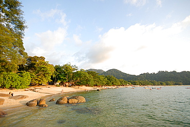 Tourists enjoying Nipah Beach at sunset time, Pangkor Island, Perak State, Malaysia, Southeast Asia, Asia