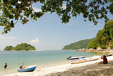 Boats and visitors at Nipah Beach, Pangkor Island, Perak State, Malaysia, Southeast Asia, Asia