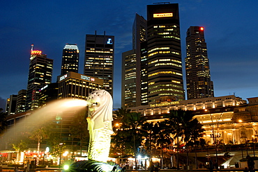 Merlion fountain with statue of half lion and fish, that has become a symbol of Singapore, with City buildings beyond, Singapore, Southeast Asia, Asia