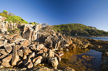 Mimosa rocks and rock pool in natural bay composed of volcanic Rhyolite rock, around 360 million years old, Mimosa Rocks National Park, New South Wales, Australia, Pacific