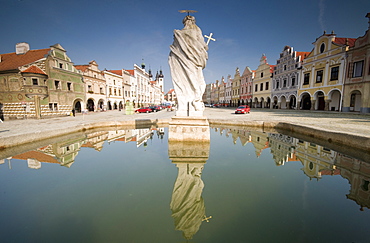 Statue of saint and fountain, Renaissance buildings at Zachariase z Hradce Square, Telc, Jihlava Region, Czech Republic, Europe