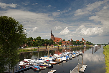 Boat harbour on the Elbe River below walls of historical town of Tangermunde, Saxony-Anhalt, Germany, Europe