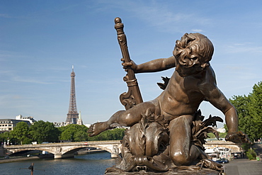 Statue on the Alexandre III Bridge, River Seine and the Eiffel Tower, Paris, France, Europe