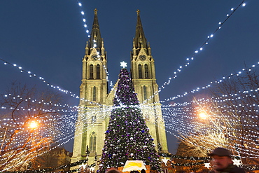 Christmas market and neo-gothic Church of St. Ludmila, Mir Square, Prague, Czech Republic, Europe 